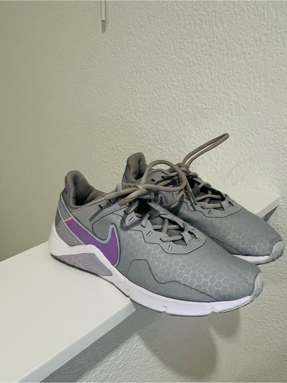 Nike Women’s Gray Sneakers with Purple Swoosh Accent